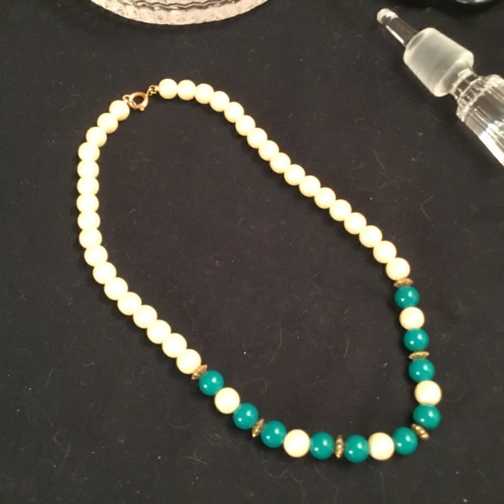 White Faux Pearl Necklace with Turquoise-Colored Beads.